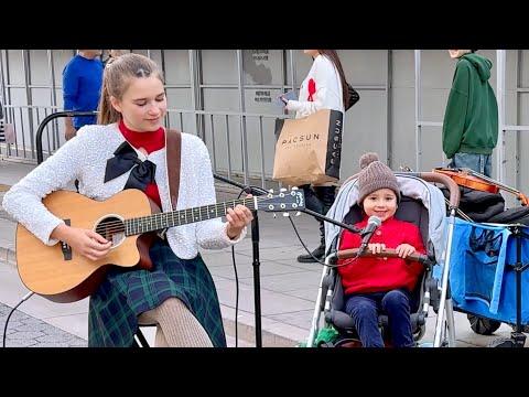 3-year-old SINGER IN A STROLLER joins "Feliz Navidad" - Karolina Protsenko